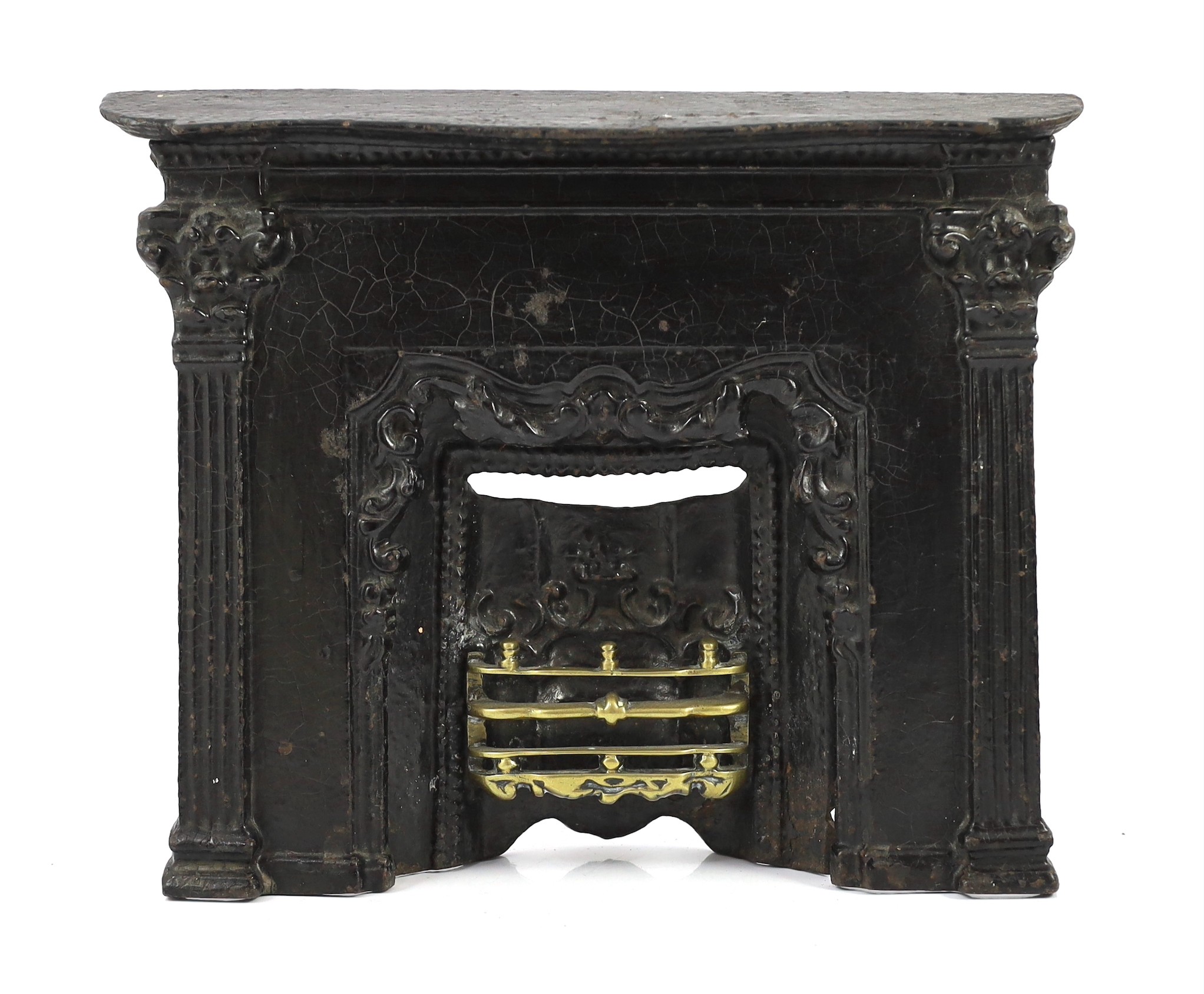 Three early 19th century cast iron model fire grates, two incorporating Royal Arms, largest 12in. wide